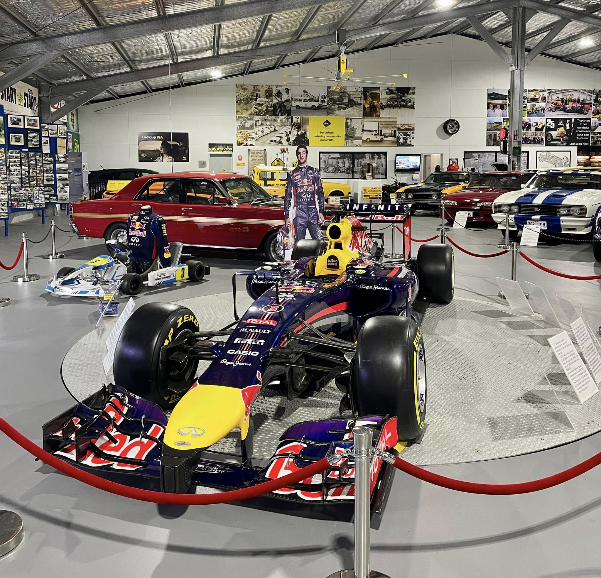 Motor Museum of WA main hall with a Red Bull Formula 1 car and HVLS fan overhead.